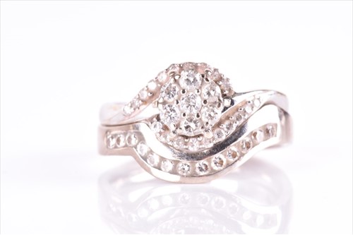 Lot 574 - A white gold and diamond floral cluster...
