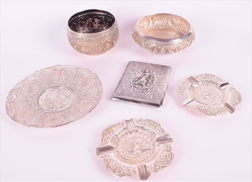 Lot 487 - A Eastern white metal (tests silver) rice bowl...