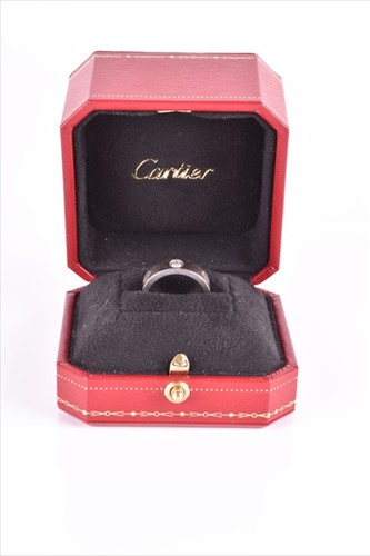 Lot 513 - Cartier. An 18ct white gold and diamond 'Love'...
