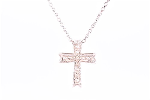 Lot 569 - An 18ct white gold and diamond cross pendant...
