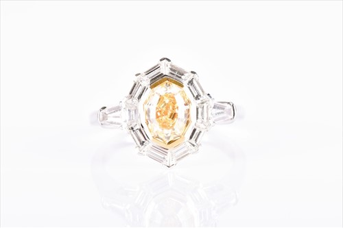 Lot 567 - An 18ct white gold, yellow and white diamond...