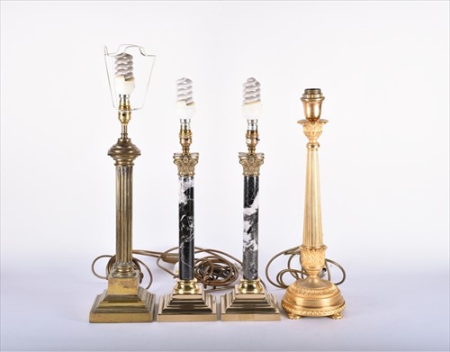 Lot 335 - A pair of 20th century Empire style lamps...