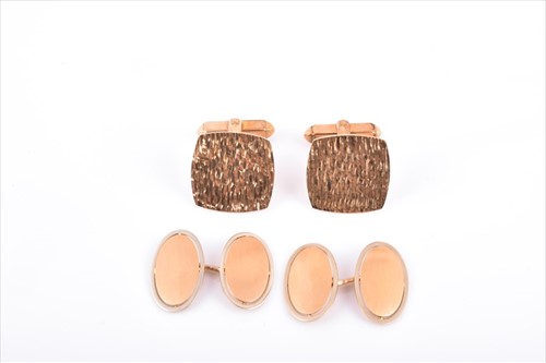 Lot 601 - A pair of yellow metal cufflinks with smooth...