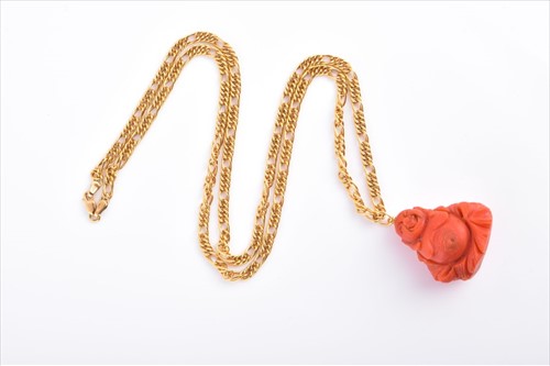 Lot 599 - An 18ct yellow gold chain necklace suspended...