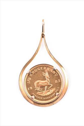 Lot 592 - A yellow metal mounted 1/2 South African...