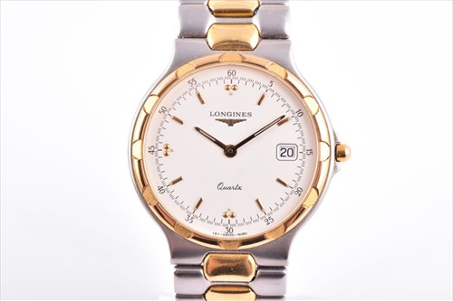 Lot 446 - A Longines Conquest two tone quartz wristwatch...