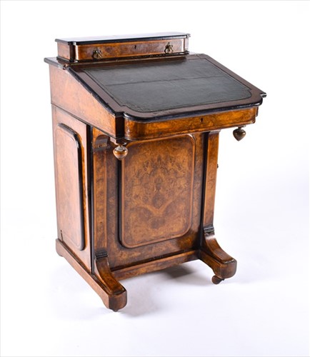 Lot 99 - A Victorian walnut and ebonised wood Davenport...