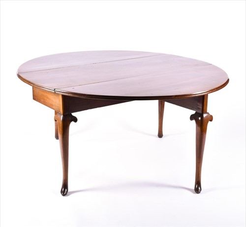 Lot 98 - A George III oak drop leaf table on four...