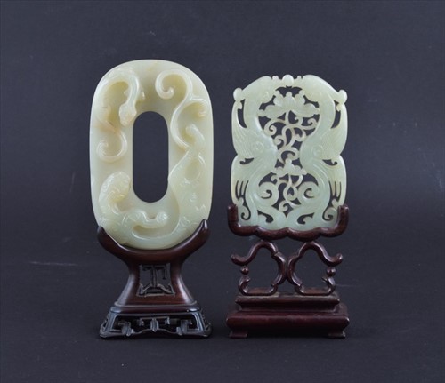 Lot 116 - A Chinese carved celadon jade plaque on a...