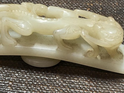 Lot 120 - Two Chinese celadon jade belt buckles each...