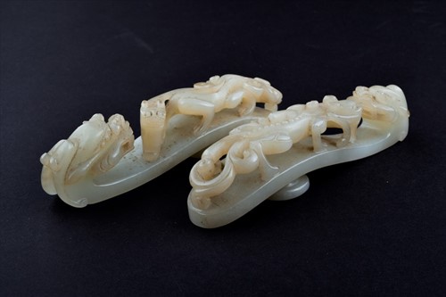 Lot 120 - Two Chinese celadon jade belt buckles each...