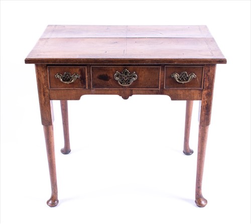 Lot 92 - An 18th century George II walnut lowboy with...