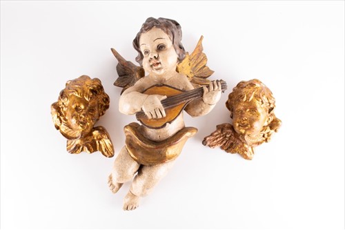 Lot 218 - A pair of early 20th century gilt cherub head...