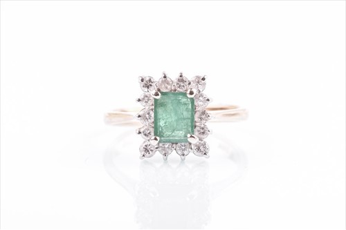 Lot 590 - A yellow metal, diamond, and emerald cluster...