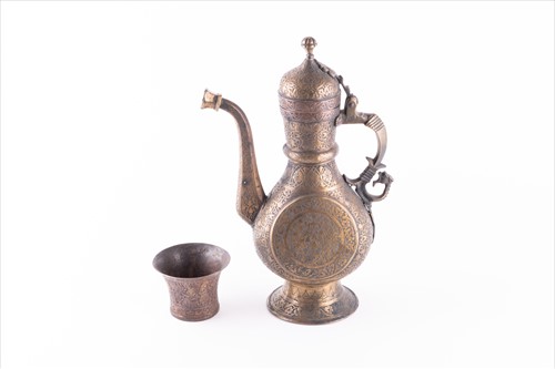 Lot 168 - A Middle Eastern damascene brass teapot...