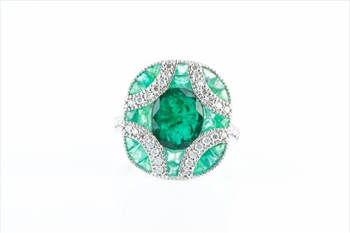 Lot 508 - A diamond and emerald cocktail ring in the Art...