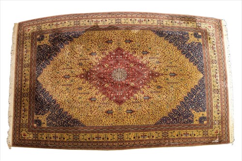 Lot 125 - A large modern Persian Tabriz style carpet...