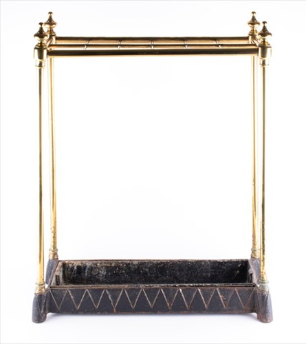 Lot 112 - A late 19th century brass and cast-iron stick...