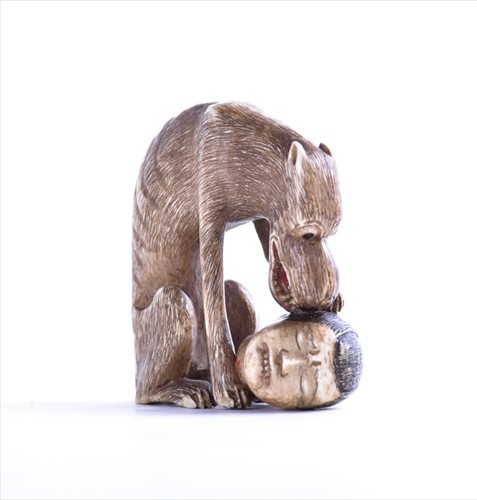 Lot 115 - A 19th century Japanese ivory netsuke modelled...