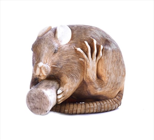 Lot 132 - A fine Japanese ivory netsuke modelled as a...