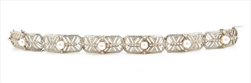 Lot 549 - A white metal and pearlÂ bracelet each...