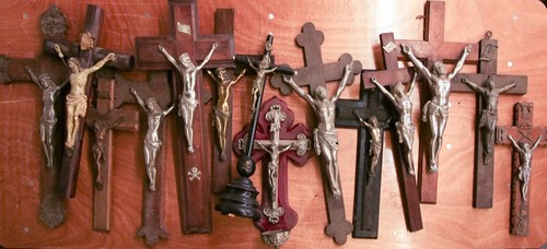 Lot 101 - A collection of large antique crucifixes,...