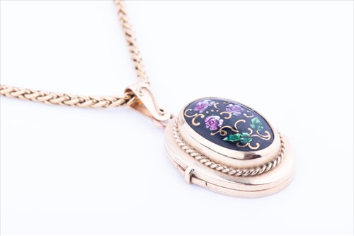 Lot 565 - A yellow metal and floral enamel locket...