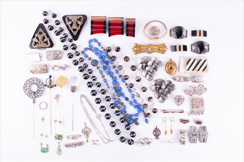 Lot 572 - Eight white metal and silver brooches...