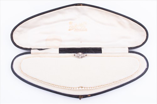 Lot 577 - A natural pearl necklace of graduated pearls,...