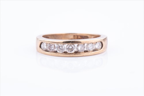 Lot 657 - A yellow metal and diamond ring, the...