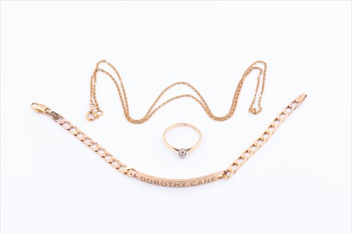 Lot 516 - A 9ct yellow gold curb-link identity bracelet...