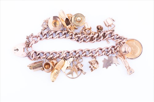 Lot 578 - A 9ct yellow gold curb-link charm bracelet...