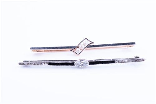 Lot 538 - A white metal, diamond, and black onyx bar...