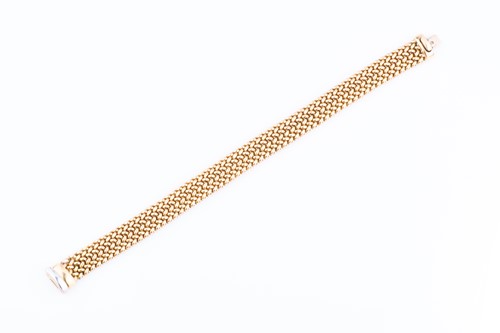 Lot 476 - A yellow metal bracelet of articulated woven...