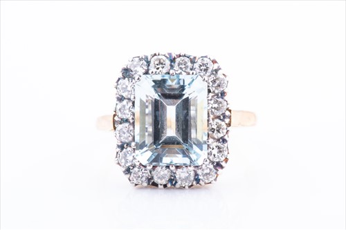 Lot 430 - A diamond and aquamarine cocktail ring set...