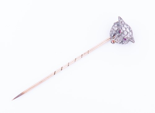 Lot 437 - A diamond-set stick pin in the form of a...