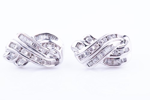 Lot 373 - A pair of white metal and diamond cluster...