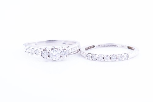 Lot 458 - A white metal and diamond ring set with three...