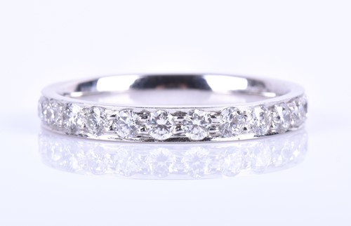 Lot 376 - A platinum and diamond eternity ring, inset...
