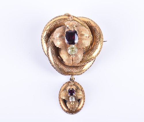 Lot 47 - A Victorian yellow gold and garnet brooch of...
