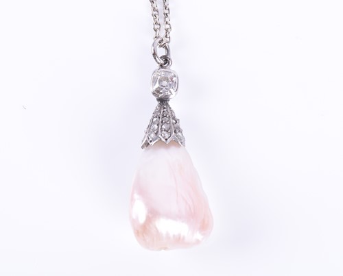 Lot 9 - A natural freshwater pearl and diamond pendant...