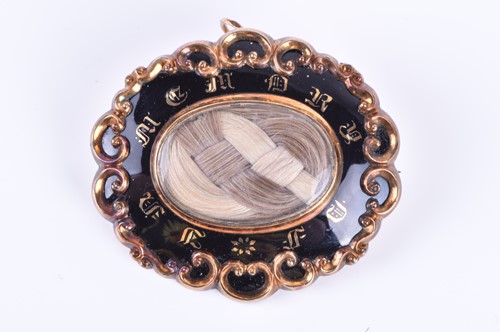 Lot 28 - A mid Victorian yellow metal and enamel...