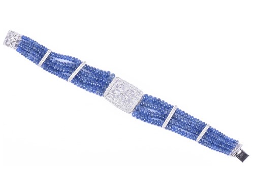 Lot 77 - A sapphire and diamond bracelet four rows of...