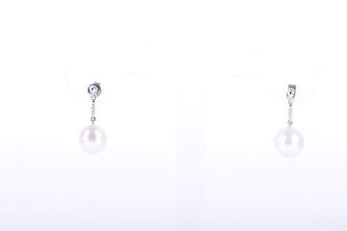 Lot 95 - A pair of 18ct white gold, diamond, and pearl...