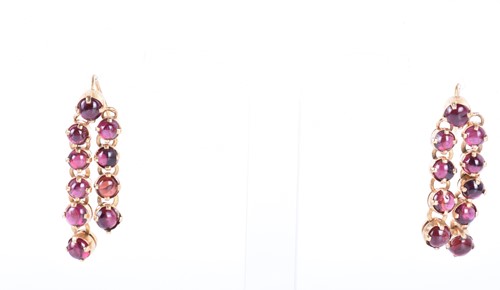 Lot 104 - A pair of yellow metal and garnet drop...