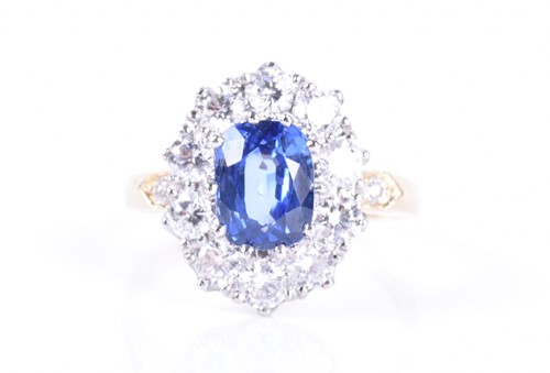 Lot 661 - An 18ct yellow gold, diamond, and sapphire...
