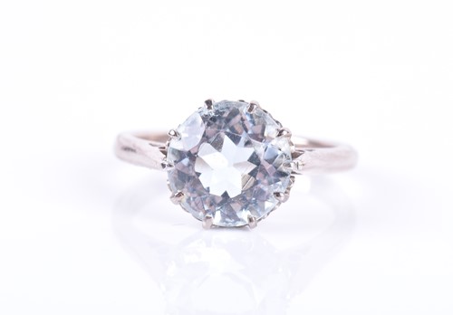 Lot 131 - An 18ct white gold and aquamarine ring set...
