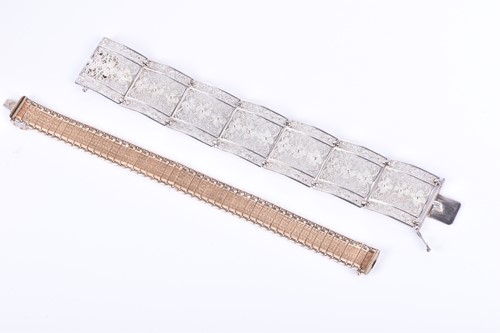 Lot 197 - A yellow metal articulated bracelet comprised...