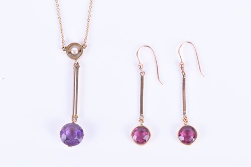 Lot 175 - An Edwardian 9ct yellow gold, amethyst, and...