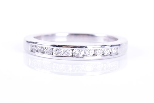Lot 188 - A white gold and diamond half eternity ring...